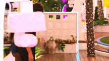 a person is standing in front of a sign that says ' i love you ' on it .