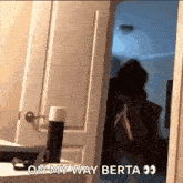 a woman is standing in a doorway with the words `` on my way berta '' written on the bottom .