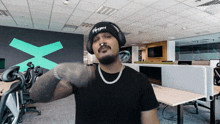 a man wearing headphones and a beanie with the word appyparty on it