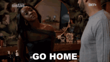 a man and a woman standing next to each other with the woman saying " go home "