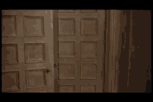 a woman in a blue strapless dress stands in front of a wooden door
