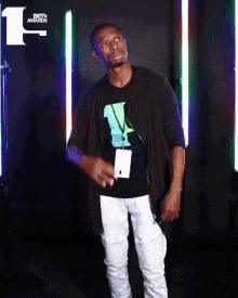 a man wearing a lanyard that says bet awards on it