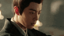 a close up of a man 's face with a very serious look on his face