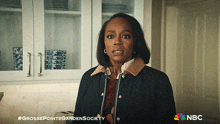 a woman in a kitchen with a nbc logo on the bottom right
