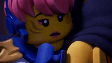 a close up of a lego figure with pink hair and headphones