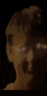 a close up of a person 's hair with a blurred background