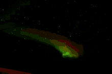 a ski lift with a green aurora borealis in the sky