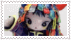 a close up of a doll with colorful hair in a postage stamp