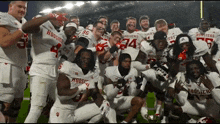 a group of hoosier football players are posing for a picture