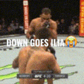 two men are fighting in a boxing ring and the words down goes ilia are on the screen