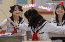a girl in a sailor uniform says ' sabar ' on a screen
