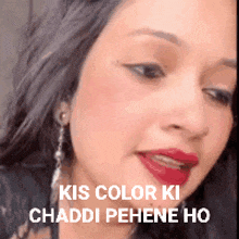 a close up of a woman 's face with the words kis color ki chaddi pehene ho on the bottom