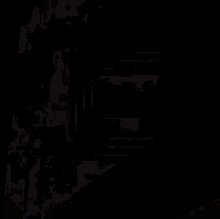 a close up of a gold colored letter e on a dark background