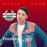 a man wearing a plaid shirt and a denim jacket with the name peeman on it