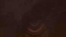a close up of a person 's face in the dark