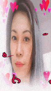 a woman 's face is surrounded by hearts and the letter s is visible