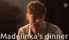 a man with blood on his face and the words madelinka 's dinner on the bottom