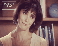a picture of a woman with the words torloni news on the bottom