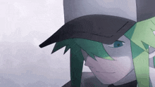 a close up of a person wearing a hat with green hair and blue eyes .