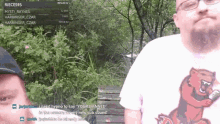 a man wearing glasses and a shirt with a tiger on it is sitting on a bench .