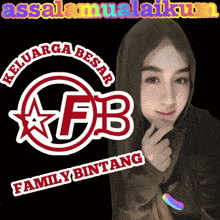 a woman wearing a hijab stands in front of a logo for family bintang