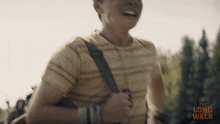 a man is running with the long walk written on the bottom of the image