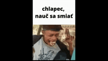 a man is laughing with a caption that says chlapec , nauč sa smiat
