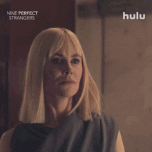 a woman 's face is shown in a hulu ad for nine perfect strangers