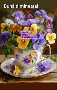 a painting of purple and yellow flowers on a saucer with the words buna dimineata