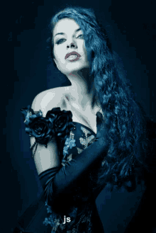 a woman with blue hair is wearing a black dress