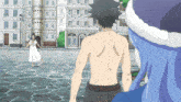a man without a shirt is standing in front of a woman