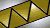 a close up of a yellow and black triangle shaped object