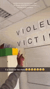 a person is pointing at the word viole on a white board