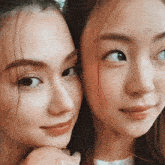a close up of two women 's faces showing their eyes