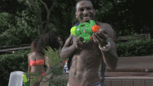 Playing With Water Gun Trouble GIF - Playing With Water Gun Trouble Wet Song GIFs