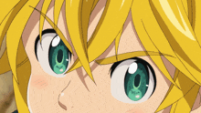 a close up of a person 's face with a yellow hair and green eyes