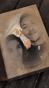 a book is open to a page with a picture of a man and a woman