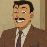 a man in a suit and tie is laughing with his tongue out