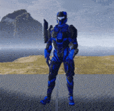 a man in a blue and black armor stands in front of a mountain