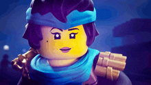 a close up of a lego girl with a blue scarf around her head