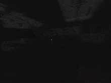 a dark room with a candle in it