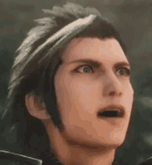 a close up of a man 's face with his mouth open and a surprised look on his face .