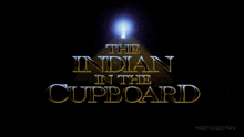 a movie poster for the indian in the cupboard with a light shining on it