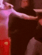 a blurry picture of a person dancing with a red background