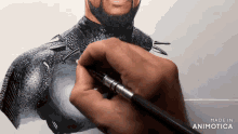 a drawing of a man with a beard is being made in animatica