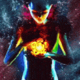 a colorful painting of a person holding a light in their hands