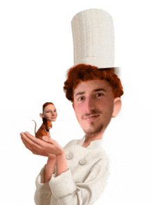 a chef holds a small mouse in his hand