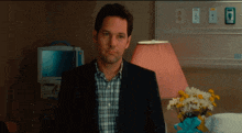 a man in a suit is in a hospital room