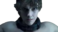 a man with a black collar around his neck looks at the camera