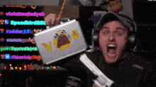 a man is holding a briefcase with a crying face on it
